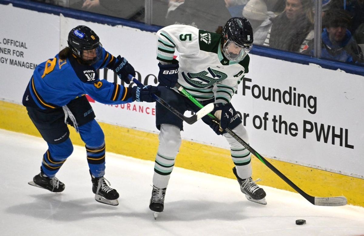 Nov 30, 2024; Toronto, ON, CANADA;  Boston Fleet defender Megan Keller (5) plays the puck against Toronto Sceptres forward Izzy Daniel (8) in the second period at Coca-Cola Coliseum. Mandatory Credit: Dan Hamilton-Imagn Images
