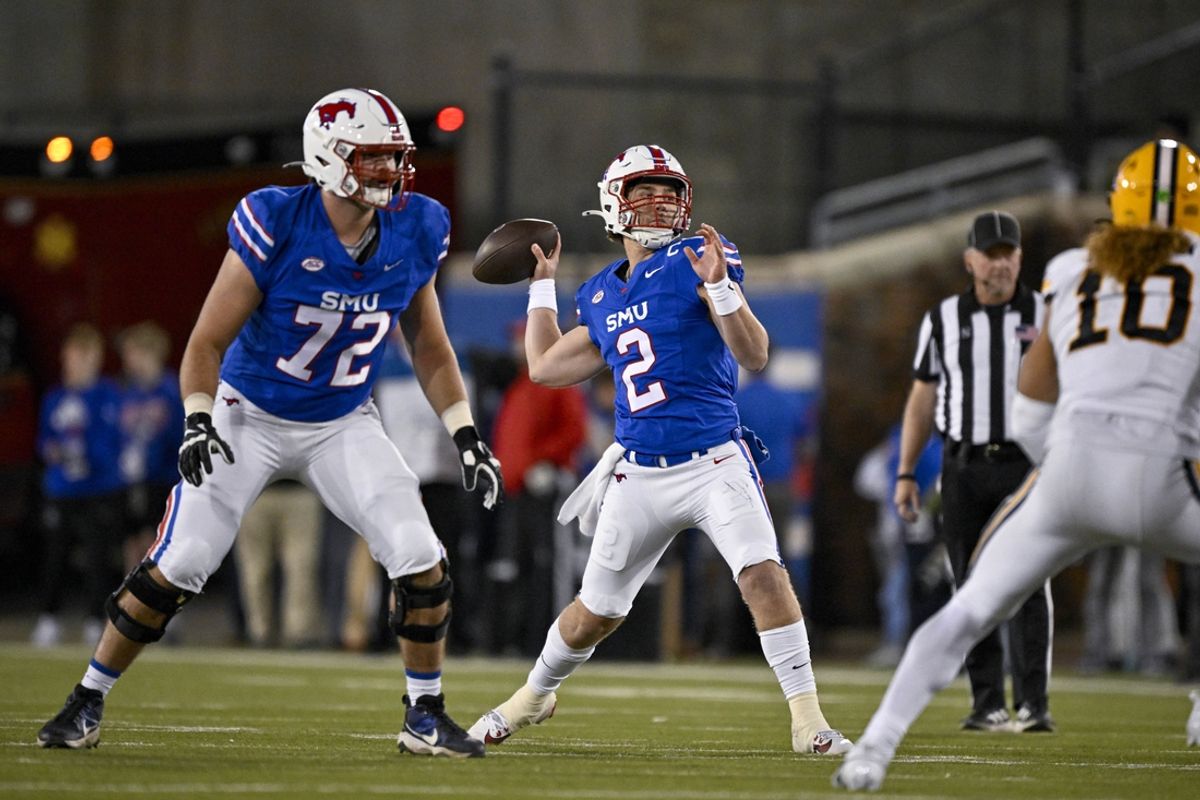 Nov 30, 2024; Dallas, Texas, USA; Southern Methodist Mustangs quarterback Preston Stone (2) passes for a touchdown to wide receiver Key'Shawn Smith (not pictured) during the second half against the California Golden Bears at Gerald J. Ford Stadium. Mandatory Credit: Jerome Miron-Imagn Images