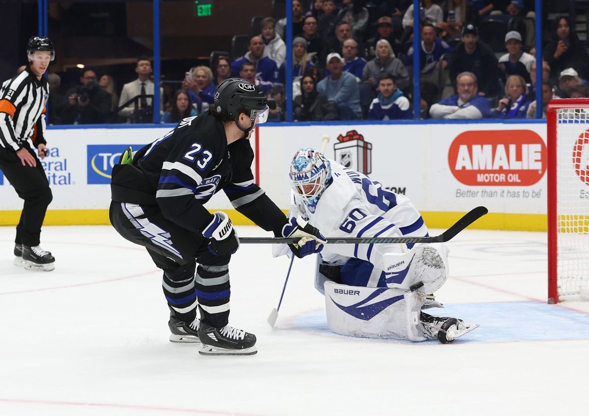 Nov 30, 2024; Tampa, Florida, USA; Tampa Bay Lightning center Michael Eyssimont (23) shoots on Toronto Maple Leafs goaltender Joseph Woll (60) as he makes a save during the first period at Amalie Arena. Mandatory Credit: Kim Klement Neitzel-Imagn Images
