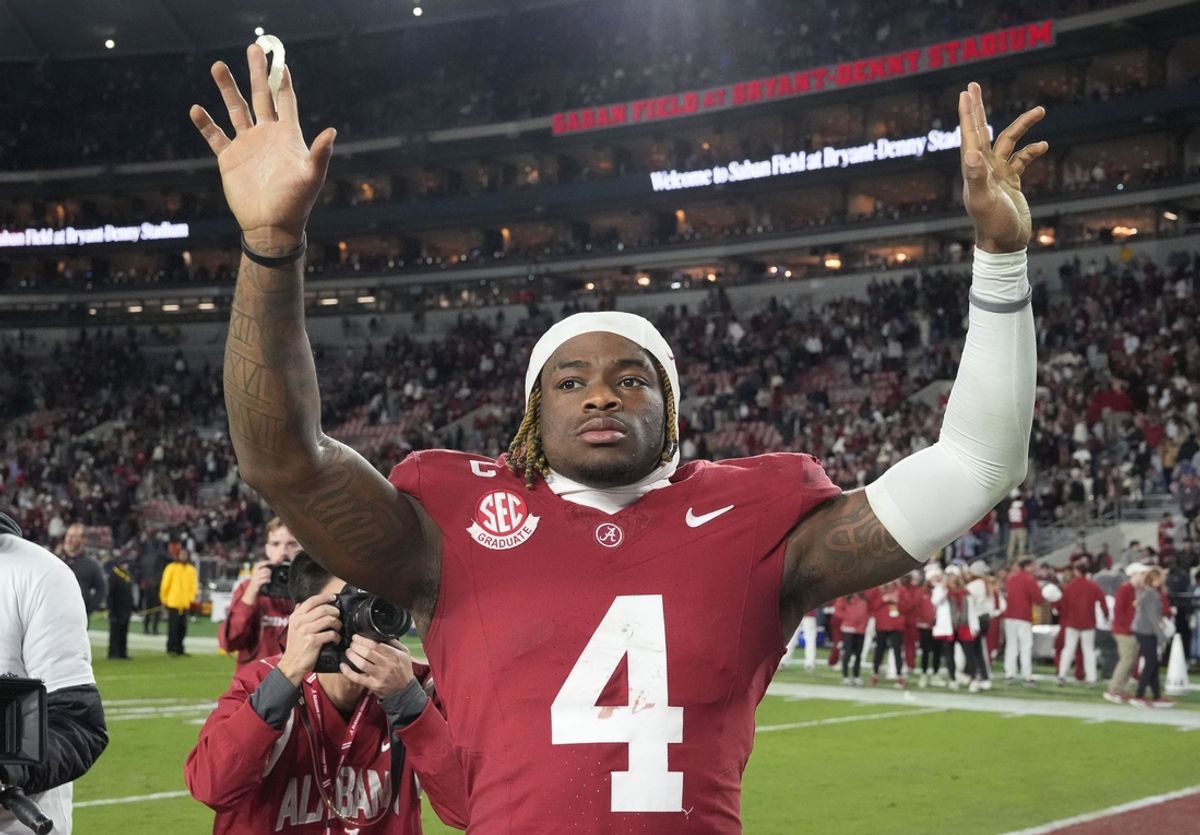 Nov 30, 2024; Tuscaloosa, Alabama, USA;  Alabama Crimson Tide quarterback Jalen Milroe (4) celebrates after defeating the Auburn Tigers at Bryant-Denny Stadium. Alabama won 28-14. Mandatory Credit: Gary Cosby Jr.-Imagn Images