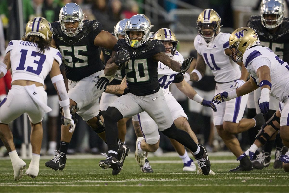 Nov 30, 2024; Eugene, Oregon, USA; Oregon Ducks running back Jordan James (20) carries the ball for a first down during the first half against the Washington Huskies at Autzen Stadium. Mandatory Credit: Troy Wayrynen-Imagn Images