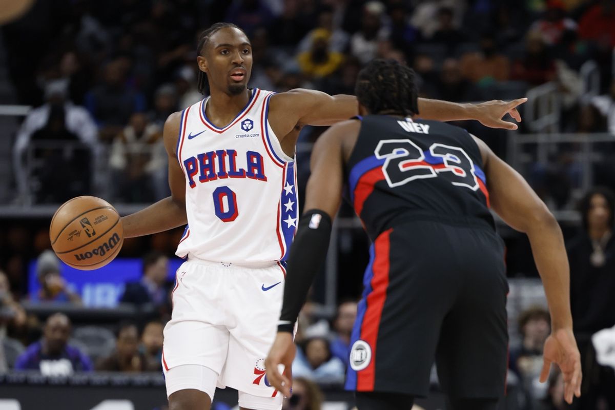 Nov 30, 2024; Detroit, Michigan, USA;  Philadelphia 76ers guard Tyrese Maxey (0) dribbles defended by Detroit Pistons guard Jaden Ivey (23) in the first half at Little Caesars Arena. Mandatory Credit: Rick Osentoski-Imagn Images