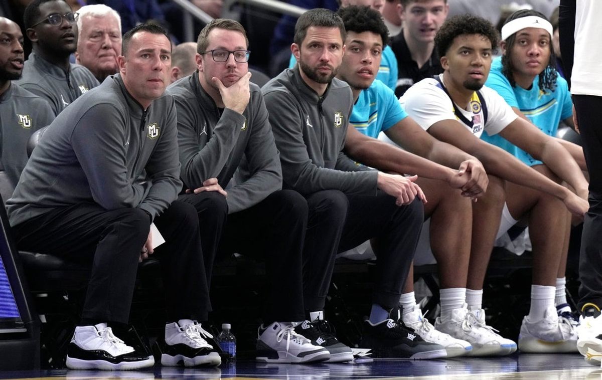 Marquette assistant coach Nevada Smith, left, director, video and analytics Devon Mulry, and assistant coach Neill Berry are shown during the second half their game Saturday, November 30, 2024 at Fiserv Forum in Milwaukee, Wisconsin. Marquette beat Western Carolina 94-62.