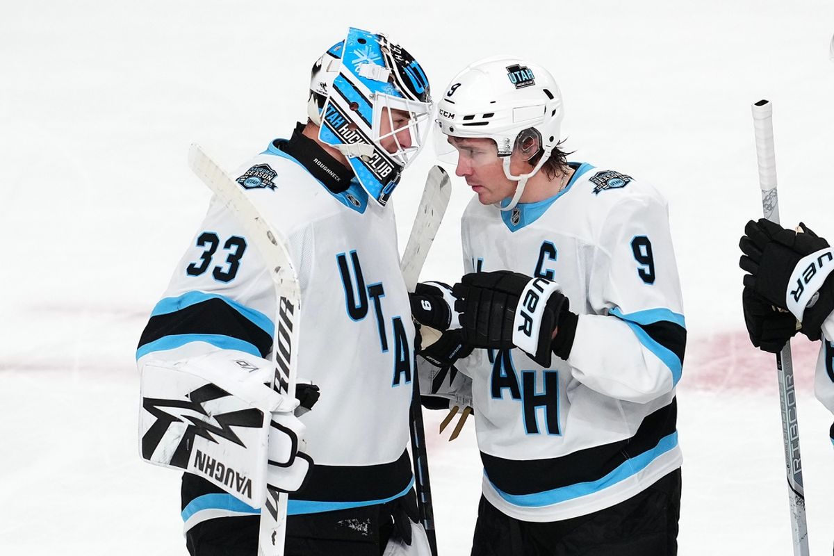 Nov 30, 2024; Las Vegas, Nevada, USA; Utah Hockey Club center Clayton Keller (9) congratulates Utah Hockey Club goaltender Jaxson Stauber (33) after the Utah Hockey Club defeated the Vegas Golden Knights 6-0 at T-Mobile Arena. Mandatory Credit: Stephen R. Sylvanie-Imagn Images