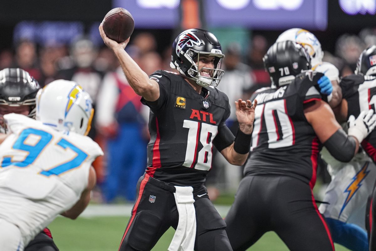 Dec 1, 2024; Atlanta, Georgia, USA; Atlanta Falcons quarterback Kirk Cousins (18) passes against the Los Angeles Chargers during the first half at Mercedes-Benz Stadium. Mandatory Credit: Dale Zanine-Imagn Images