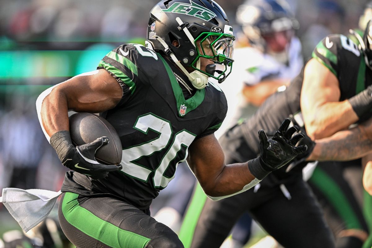 Dec 1, 2024; East Rutherford, New Jersey, USA; New York Jets running back Breece Hall (20) runs with the ball during the first quarter against the Seattle Seahawks at MetLife Stadium. Mandatory Credit: Mark Smith-Imagn Images
