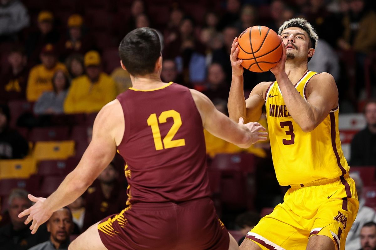 Dec 1, 2024; Minneapolis, Minnesota, USA; Minnesota Golden Gophers forward Dawson Garcia (3) shoots as Bethune-Cookman Wildcats forward Jesus Carralero Martin (12) defends during the first half at Williams Arena. Mandatory Credit: Matt Krohn-Imagn Images