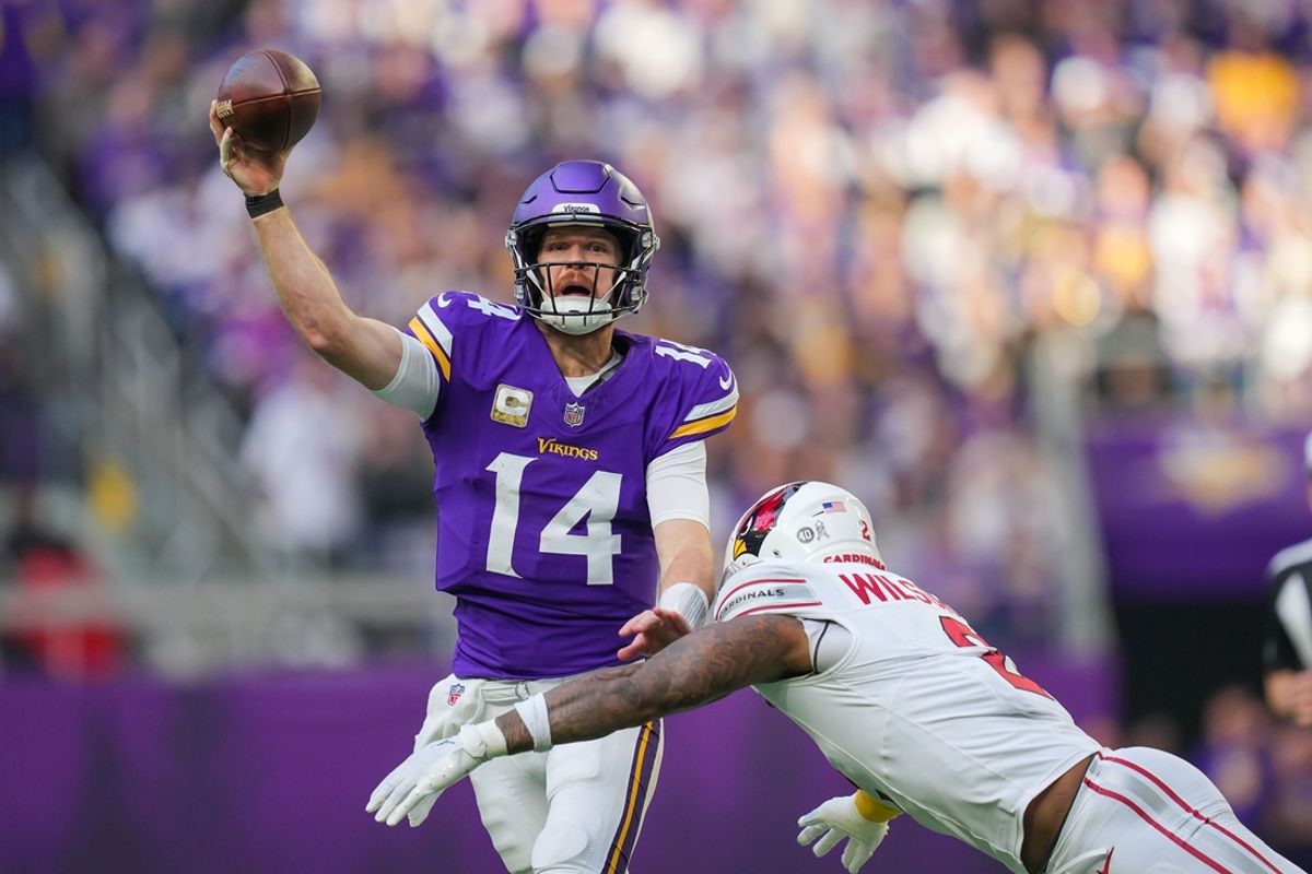 Dec 1, 2024; Minneapolis, Minnesota, USA; Minnesota Vikings quarterback Sam Darnold (14) passes against the Arizona Cardinals in the third quarter at U.S. Bank Stadium. Mandatory Credit: Brad Rempel-Imagn Images
