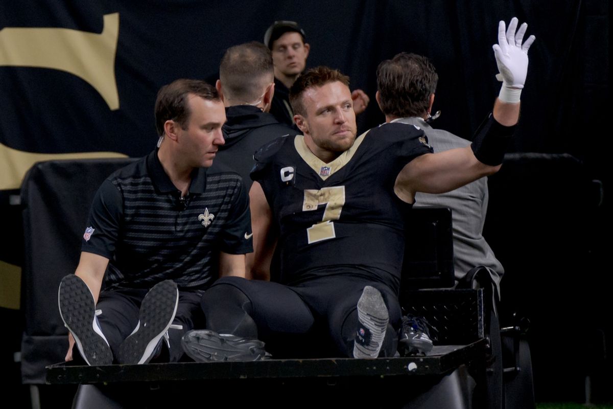 Dec 1, 2024; New Orleans, Louisiana, USA; New Orleans Saints tight end Taysom Hill (7) leaves the field after an injury against the Los Angeles Rams during the second half at Caesars Superdome. Mandatory Credit: Matthew Hinton-Imagn Images