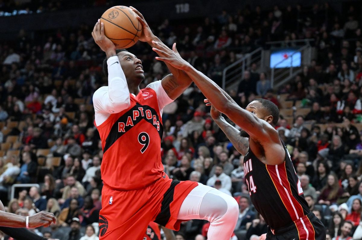 Dec 1, 2024; Toronto, Ontario, CAN;  Toronto Raptors forward RJ Barrett (9) drives to the net against Miami Heat forward Haywood Highsmith (24) in the second half at Scotiabank Arena. Mandatory Credit: Dan Hamilton-Imagn Images