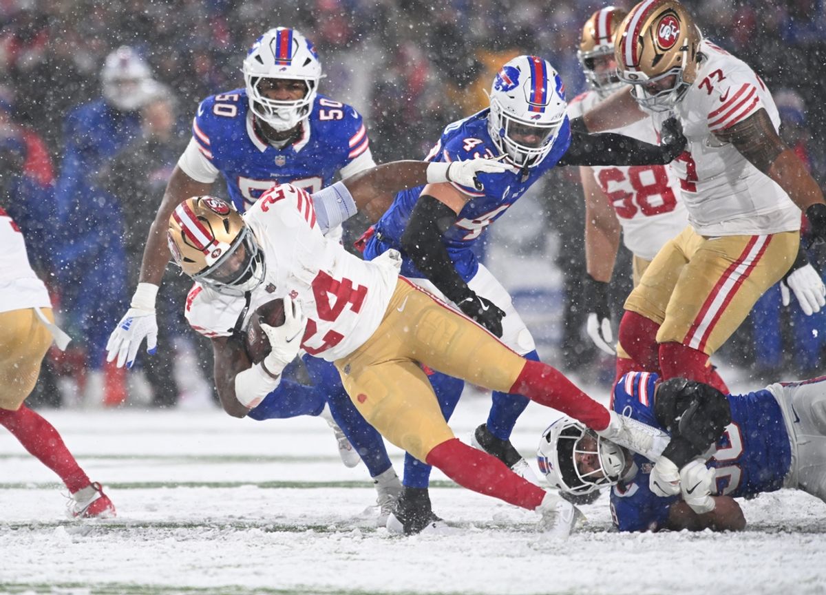Dec 1, 2024; Orchard Park, New York, USA; San Francisco 49ers running back Jordan Mason (24) is tackled by Buffalo Bills linebacker Nicholas Morrow (32) in the second quarter at Highmark Stadium. Mandatory Credit: Mark Konezny-Imagn Images