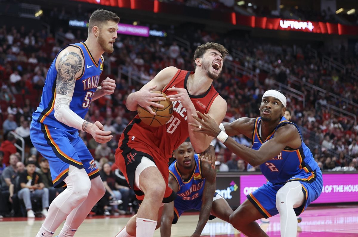 Dec 1, 2024; Houston, Texas, USA; Houston Rockets center Alperen Sengun (28) attempts to secure the ball away from Oklahoma City Thunder center Isaiah Hartenstein (55) and guard Shai Gilgeous-Alexander (2) during the fourth quarter at Toyota Center. Mandatory Credit: Troy Taormina-Imagn Images
