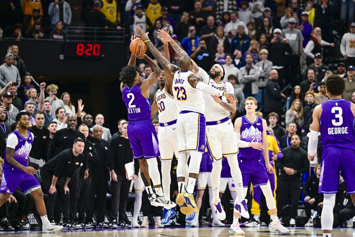 Dec 1, 2024; Salt Lake City, Utah, USA; Utah Jazz guard Collin Sexton (2) gets blocked by Los Angeles Lakers forward LeBron James (23), forward/center Anthony Davis (3), and center Christian Koloko (10) in the final second of the second half at the Delta Center. Mandatory Credit: Christopher Creveling-Imagn Images