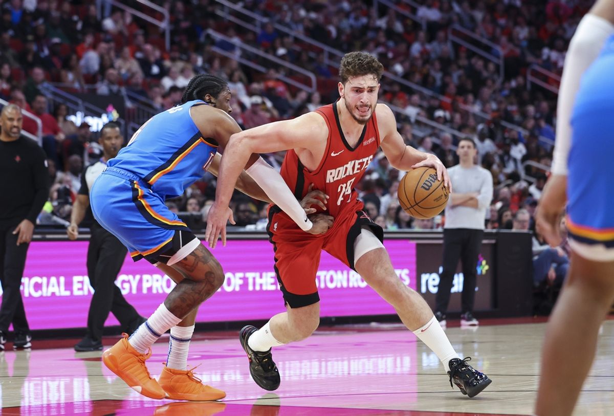Dec 1, 2024; Houston, Texas, USA; Houston Rockets center Alperen Sengun (28) drives to the basket as Oklahoma City Thunder forward Jalen Williams (8) defends during the third quarter at Toyota Center. Mandatory Credit: Troy Taormina-Imagn Images