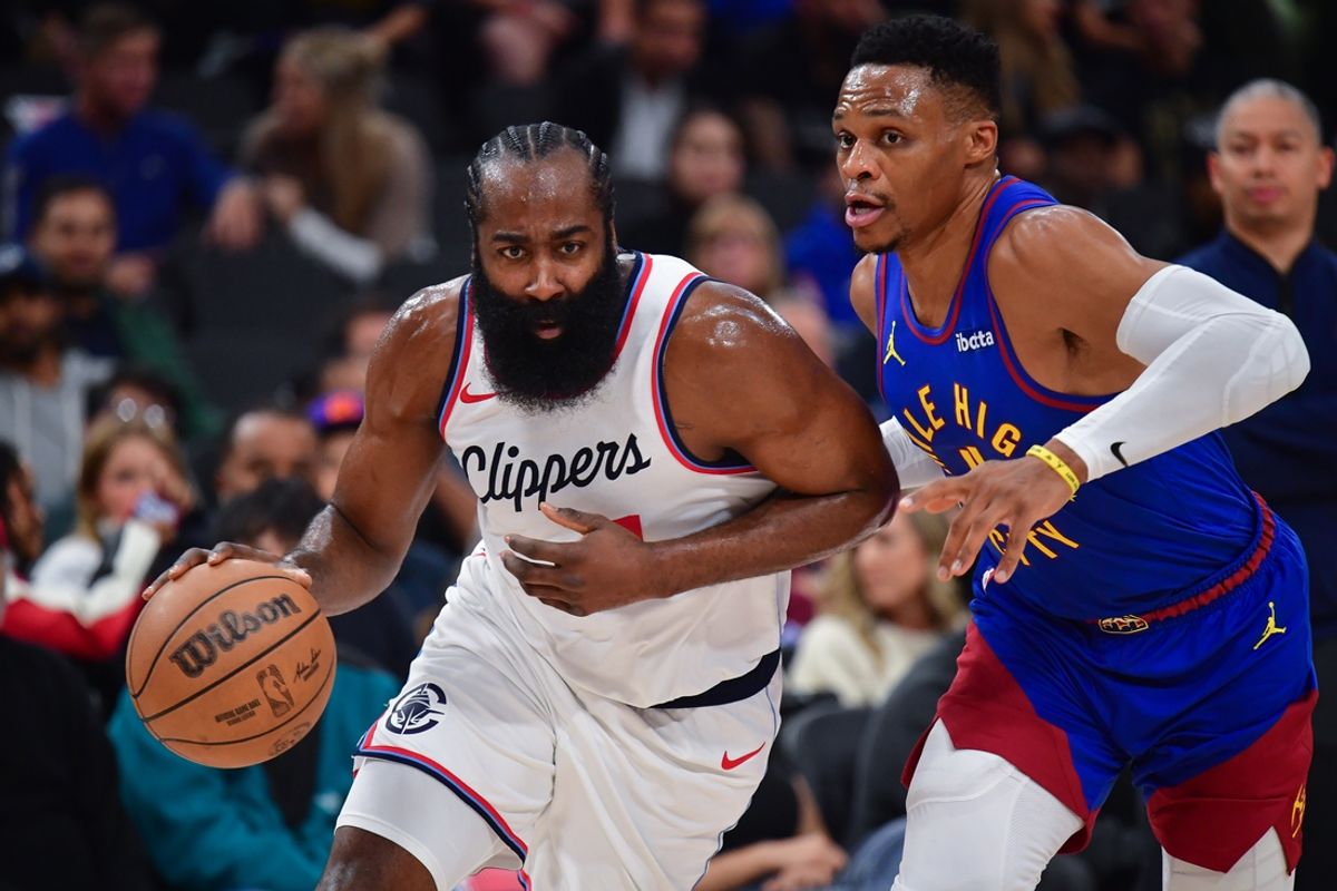 Dec 1, 2024; Inglewood, California, USA; Los Angeles Clippers guard James Harden (1) moves the ball against Denver Nuggets guard Russell Westbrook (4) during the first half at Intuit Dome. Mandatory Credit: Gary A. Vasquez-Imagn Images