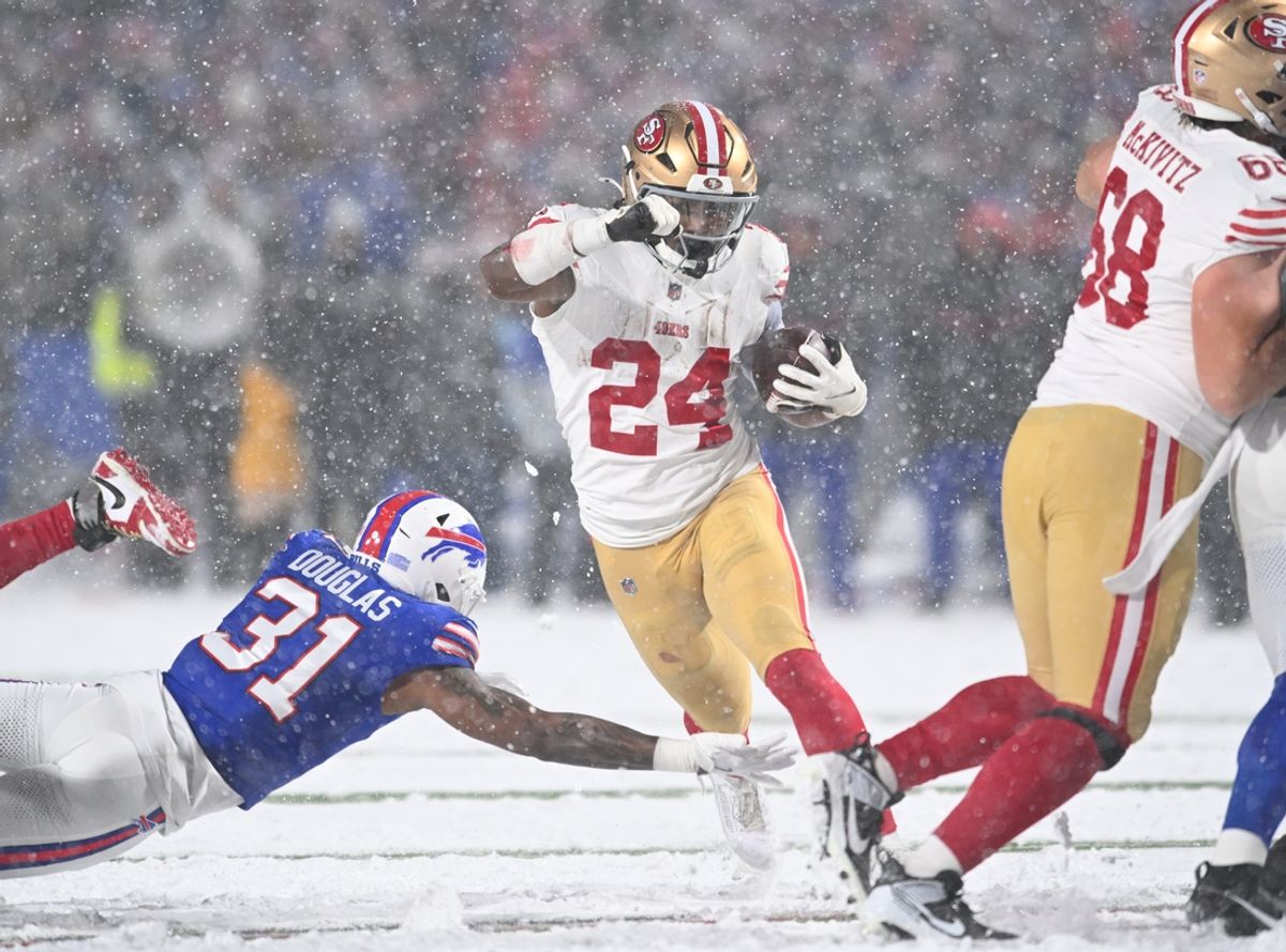 Dec 1, 2024; Orchard Park, New York, USA; San Francisco 49ers running back Jordan Mason (24) avoids a tackle by Buffalo Bills cornerback Rasul Douglas (31) in the third quarter at Highmark Stadium. Mandatory Credit: Mark Konezny-Imagn Images