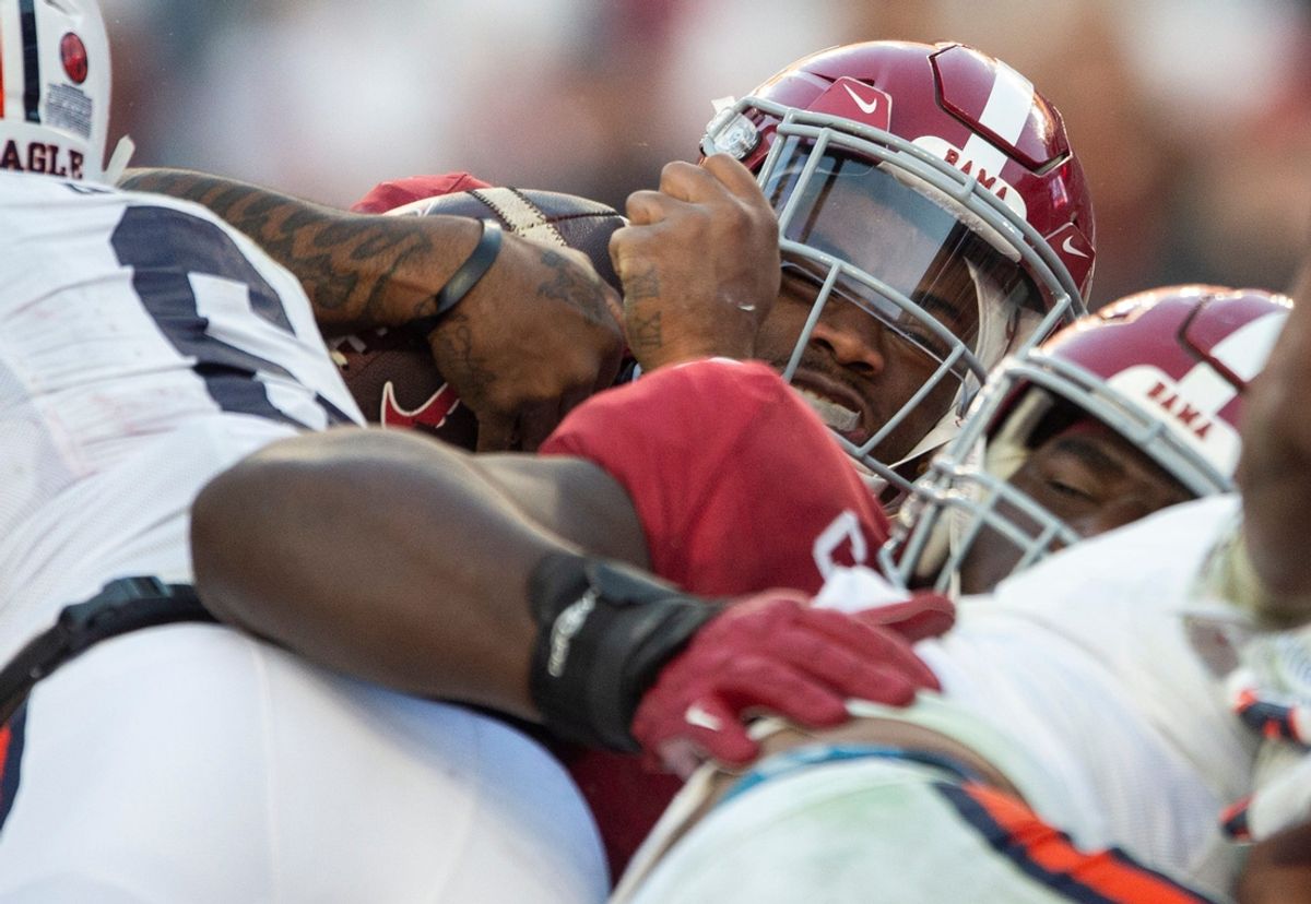 Alabama Crimson Tide quarterback Jalen Milroe (4) dives into the end zone for a touchdown as Auburn Tigers take on Alabama Crimson Tide at Bryant-Denny Stadium in Tuscaloosa, Ala., on Saturday, Nov. 30, 2024. Alabama Crimson Tide defeated Auburn Tigers 28-14.