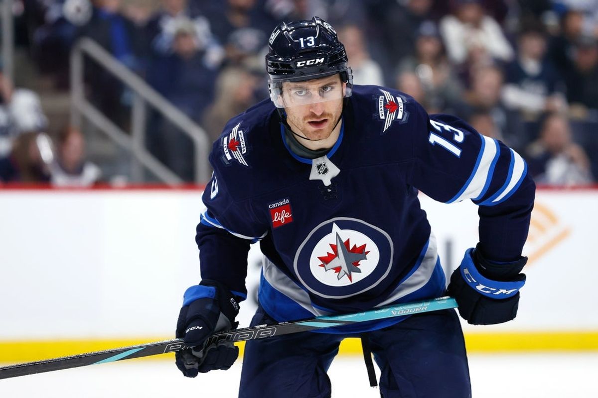 Nov 19, 2024; Winnipeg, Manitoba, CAN; Winnipeg Jets center Gabriel Vilardi (13) waits for a face off in the second period against the Florida Panthers  at Canada Life Centre. Mandatory Credit: James Carey Lauder-Imagn Images