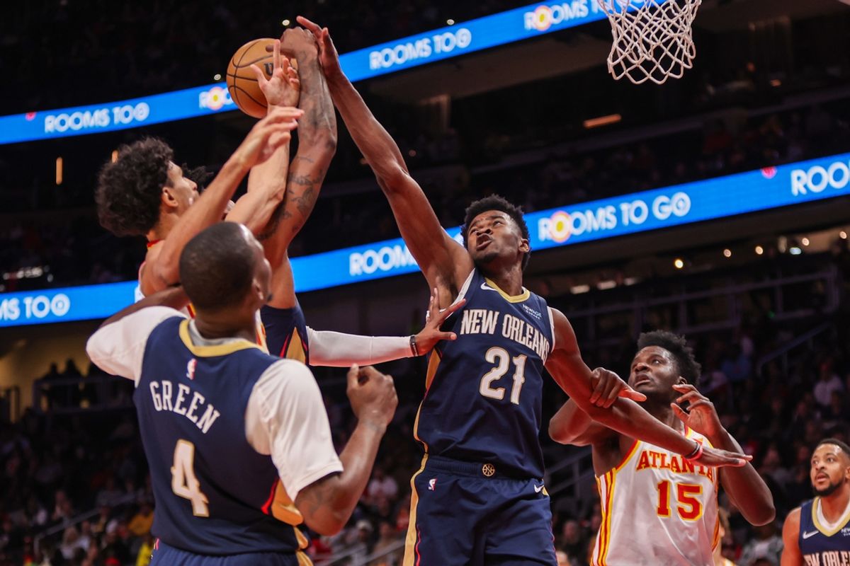 Dec 2, 2024; Atlanta, Georgia, USA; New Orleans Pelicans center Yves Missi (21) blocks the shot of Atlanta Hawks forward Zaccharie Risacher (10) in the second quarter at State Farm Arena. Mandatory Credit: Brett Davis-Imagn Images