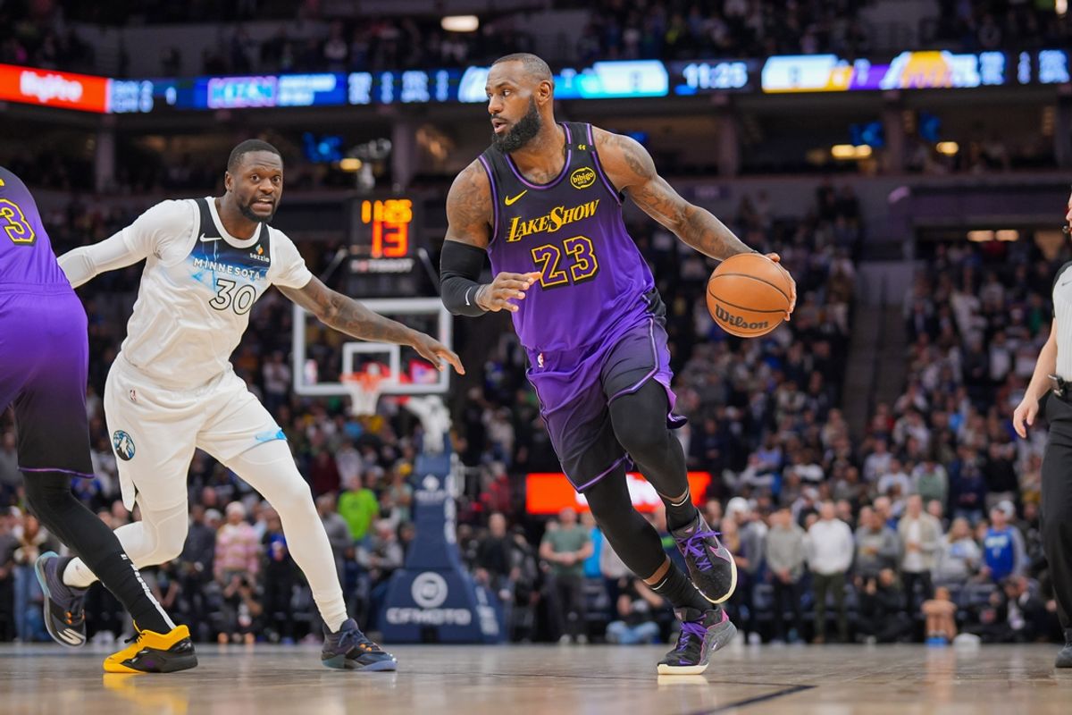 Dec 2, 2024; Minneapolis, Minnesota, USA; Los Angeles Lakers forward LeBron James (23) dribbles against the Minnesota Timberwolves in the first quarter at Target Center. Mandatory Credit: Brad Rempel-Imagn Images