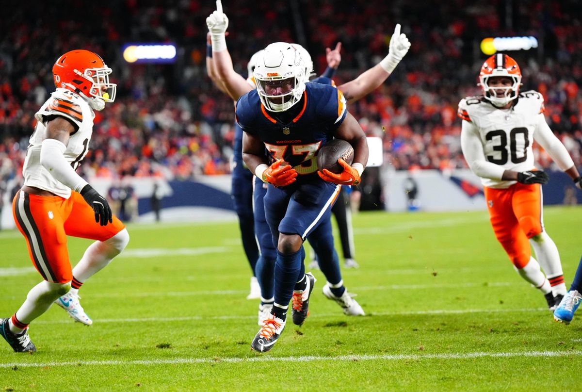 Dec 2, 2024; Denver, Colorado, USA; Denver Broncos running back Javonte Williams (33) scores a touchdown in the first quarter against the Cleveland Browns at Empower Field at Mile High. Mandatory Credit: Ron Chenoy-Imagn Images