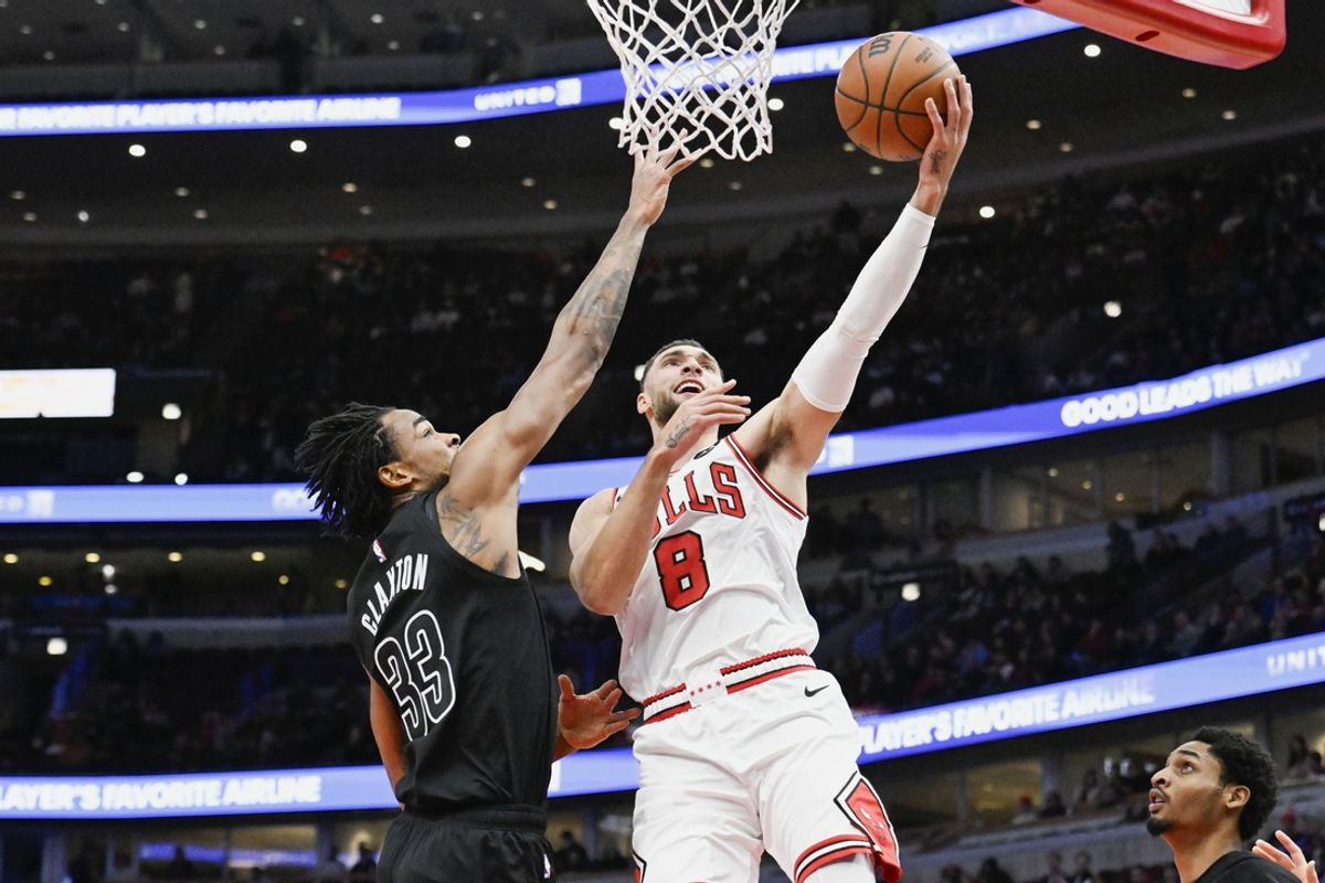 Dec 2, 2024; Chicago, Illinois, USA;  Chicago Bulls guard Zach LaVine (8) shoots against Brooklyn Nets center Nic Claxton (33) during the first half at the  United Center. Mandatory Credit: Matt Marton-Imagn Images