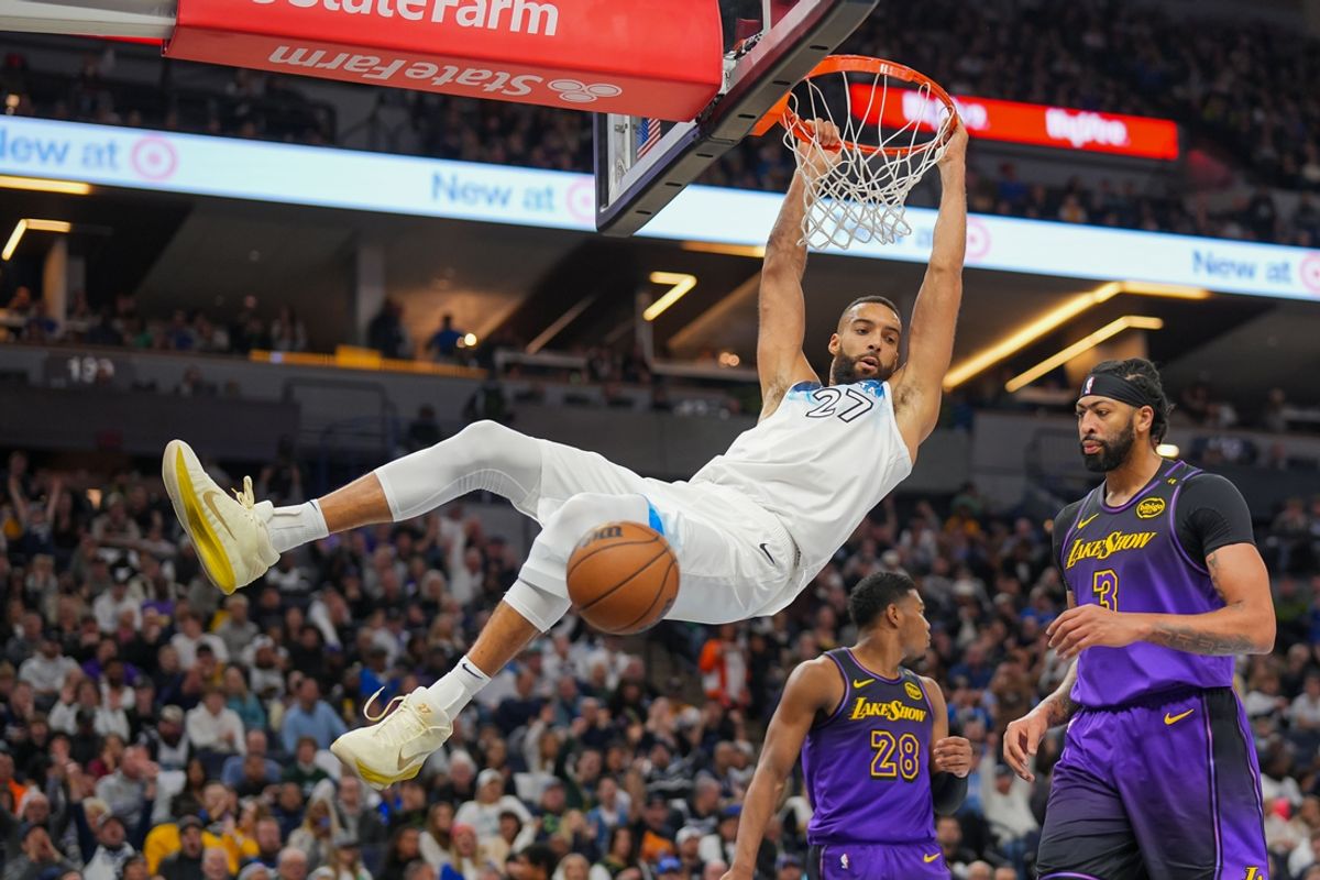 Dec 2, 2024; Minneapolis, Minnesota, USA; Minnesota Timberwolves center Rudy Gobert (27) dunks against the Los Angeles Lakers in the third quarter at Target Center. Mandatory Credit: Brad Rempel-Imagn Images