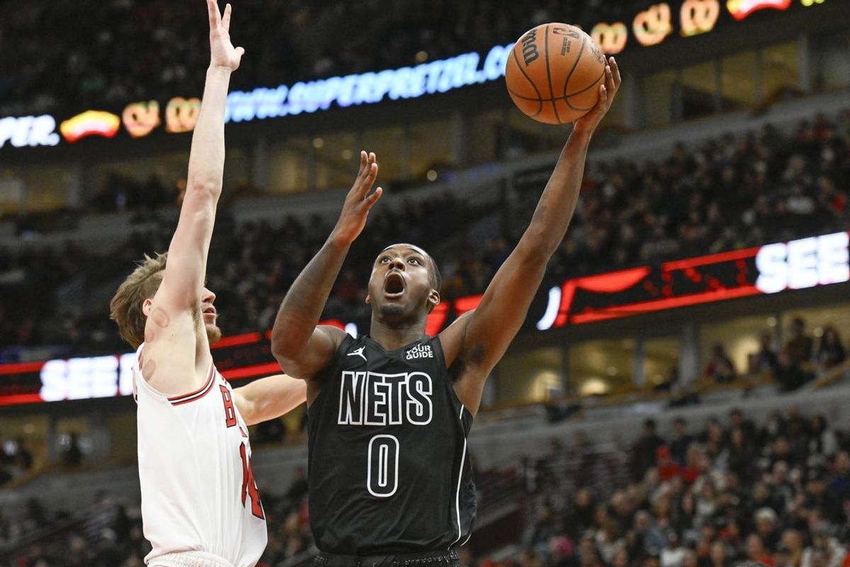Dec 2, 2024; Chicago, Illinois, USA; Brooklyn Nets forward Dariq Whitehead (0) shoots against Chicago Bulls forward Matas Buzelis (14) during the second half at the United Center. Mandatory Credit: Matt Marton-Imagn Images