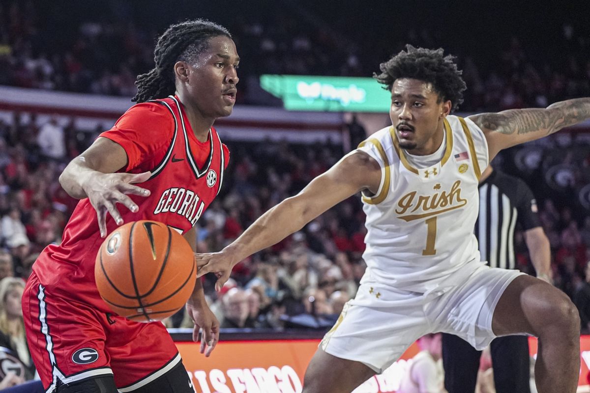 Dec 3, 2024; Athens, Georgia, USA; Georgia Bulldogs guard Silas Demary Jr. (5) is defended by Notre Dame Fighting Irish guard Julian Roper II (1) during the first half at Stegeman Coliseum. Mandatory Credit: Dale Zanine-Imagn Images