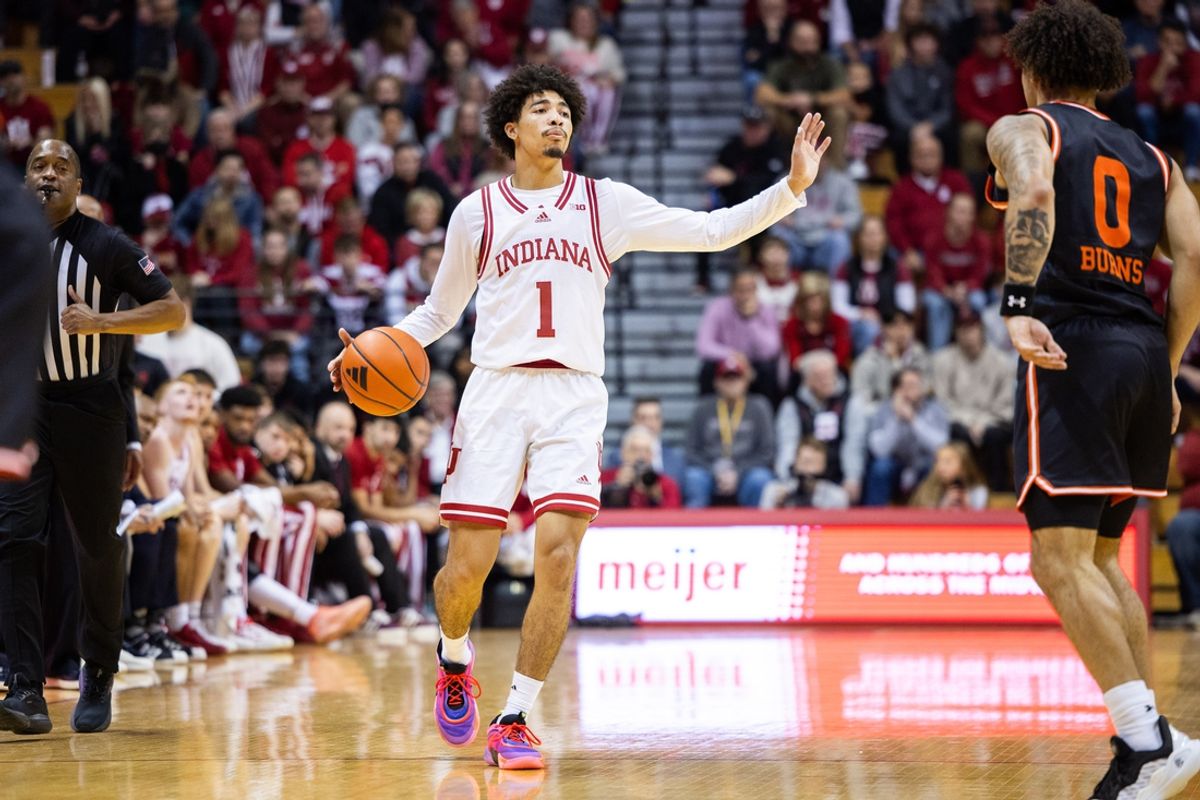Dec 3, 2024; Bloomington, Indiana, USA; Indiana Hoosiers guard Myles Rice (1) dribbles the ball while Sam Houston State Bearkats guard Brennen Burns (0) defends in the first half at Simon Skjodt Assembly Hall. Mandatory Credit: Trevor Ruszkowski-Imagn Images