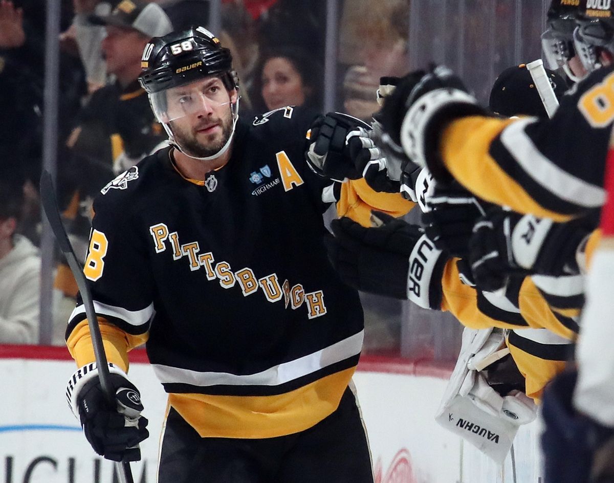 Dec 3, 2024; Pittsburgh, Pennsylvania, USA;  Pittsburgh Penguins defenseman Kris Letang (58) celebrates his goal with the bench against the Florida Panthers during the second period at PPG Paints Arena. Mandatory Credit: Charles LeClaire-Imagn Images