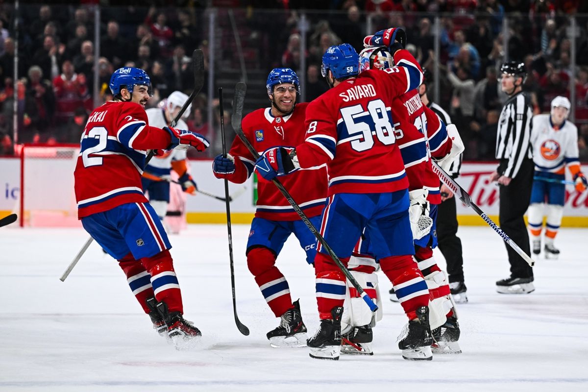 Dec 3, 2024; Montreal, Quebec, CAN; Montreal Canadiens players gather around goalie Sam Montembeault (35) to celebrate the win against the New York Islanders at Bell Centre. Mandatory Credit: David Kirouac-Imagn Images
