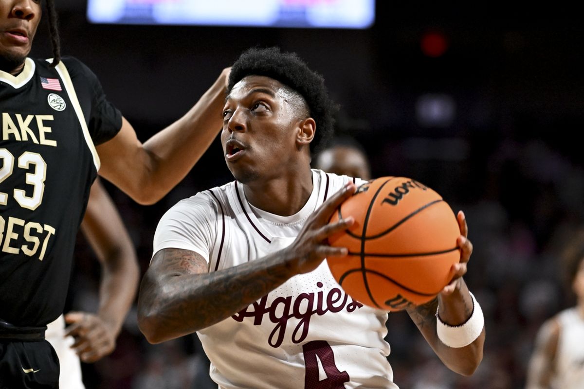 Dec 3, 2024; College Station, Texas, USA; Texas A&M Aggies guard Wade Taylor IV (4) drives to the basket against the Wake Forest Demon Deacons during the first half at Reed Arena. Mandatory Credit: Maria Lysaker-Imagn Images