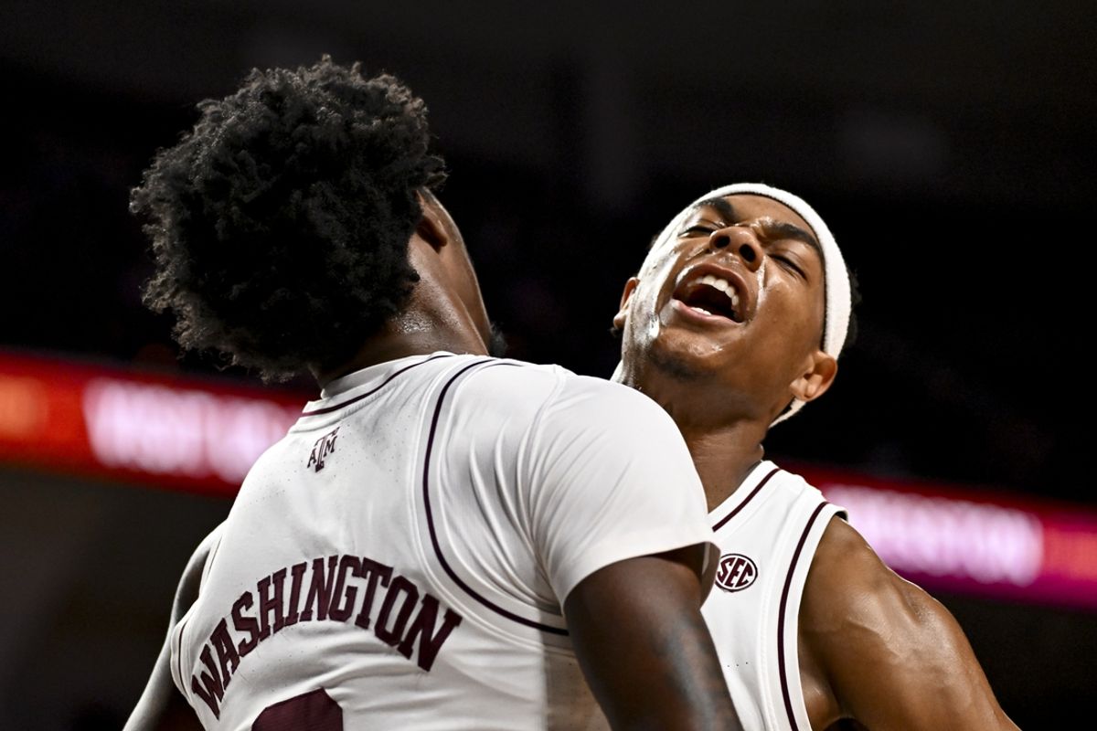 Dec 3, 2024; College Station, Texas, USA; Texas A&M Aggies guard Zhuric Phelps (1) celebrates with forward Solomon Washington (9) during the first half against the Wake Forest Demon Deacons at Reed Arena. Mandatory Credit: Maria Lysaker-Imagn Images