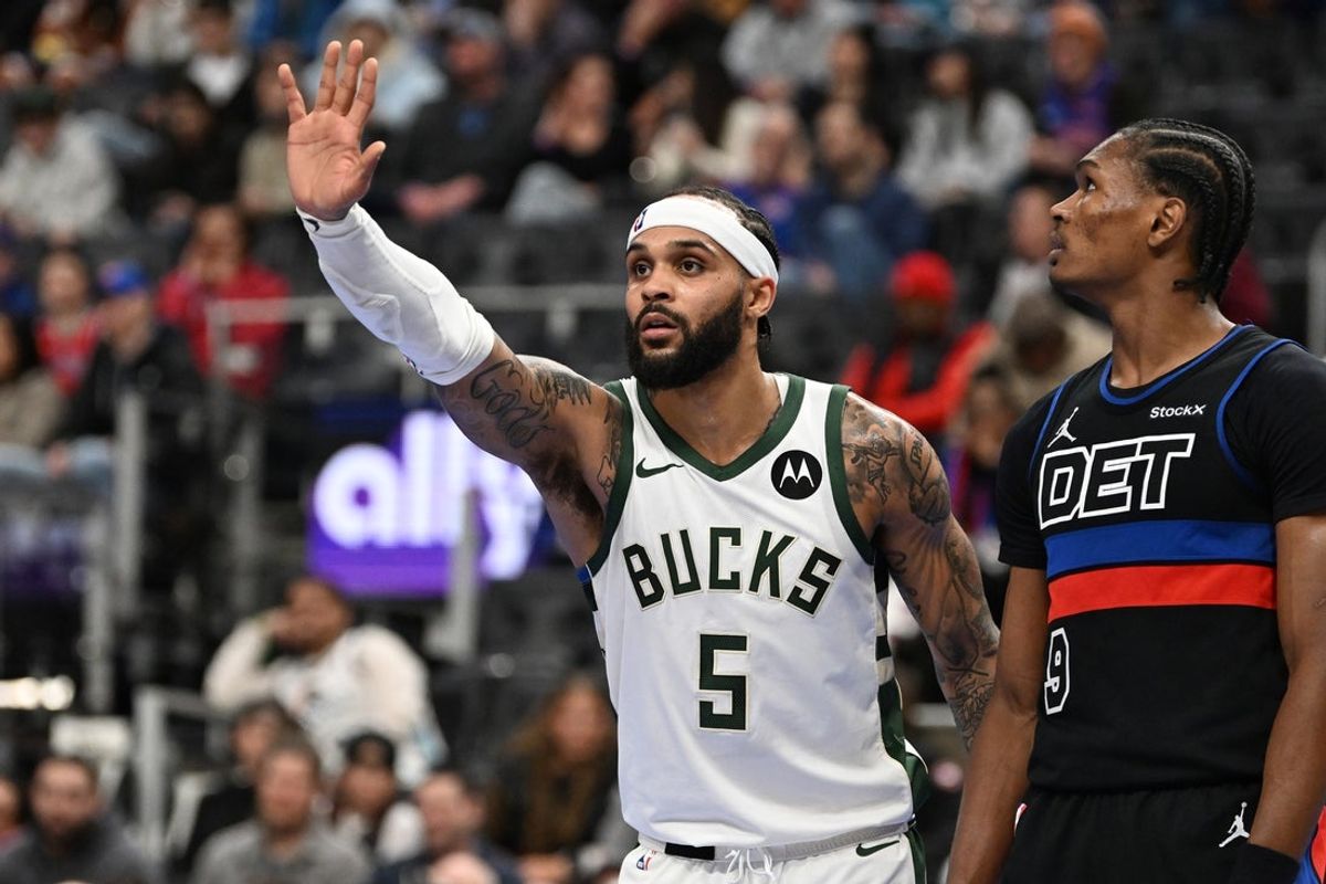 Dec 3, 2024; Detroit, Michigan, USA; Milwaukee Bucks guard Gary Trent Jr. (5) signals to a teammate across the key before a foul shot against the Detroit Pistons in the second quarter at Little Caesars Arena. Mandatory Credit: Lon Horwedel-Imagn Images