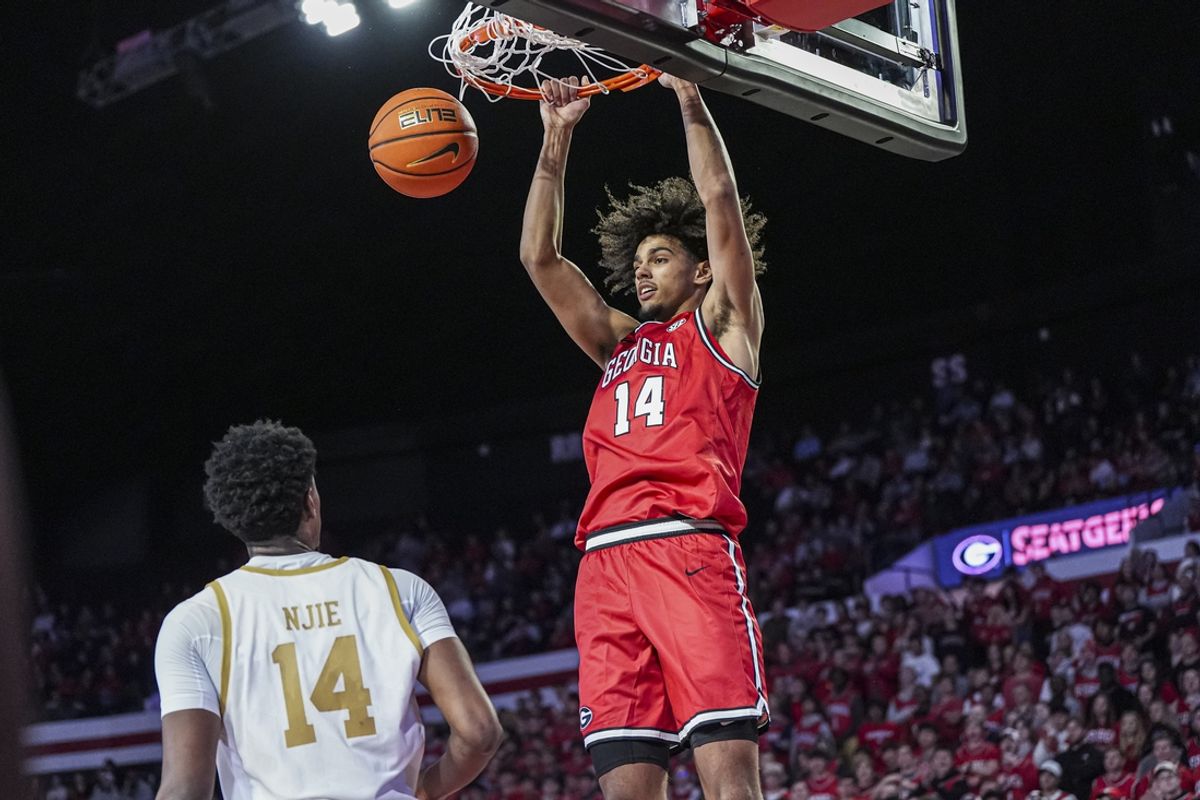 Dec 3, 2024; Athens, Georgia, USA; Georgia Bulldogs forward Asa Newell (14) dunks in front of Notre Dame Fighting Irish forward Kebba Njie (14) at Stegeman Coliseum. Mandatory Credit: Dale Zanine-Imagn Images