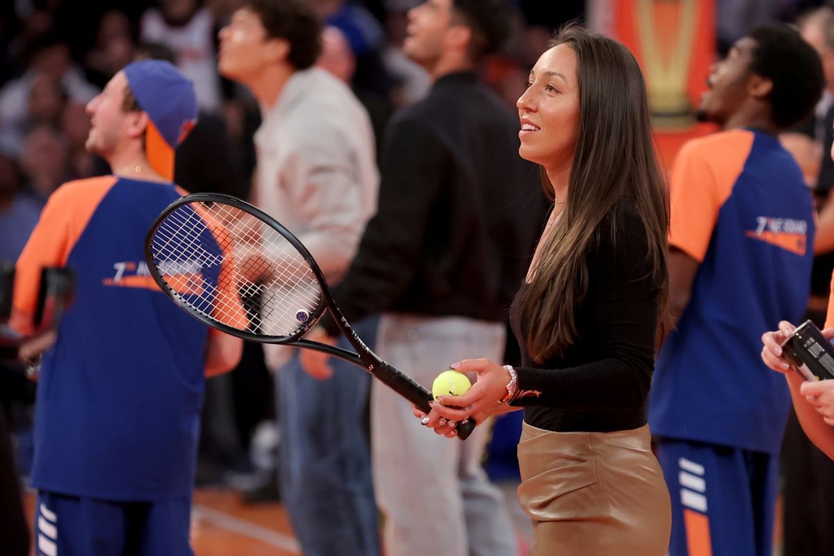 Dec 3, 2024; New York, New York, USA; American tennis player Jessica Pegula hits tennis balls into the stands during a time out during the third quarter between the New York Knicks and the Orlando Magic at Madison Square Garden. Mandatory Credit: Brad Penner-Imagn Images