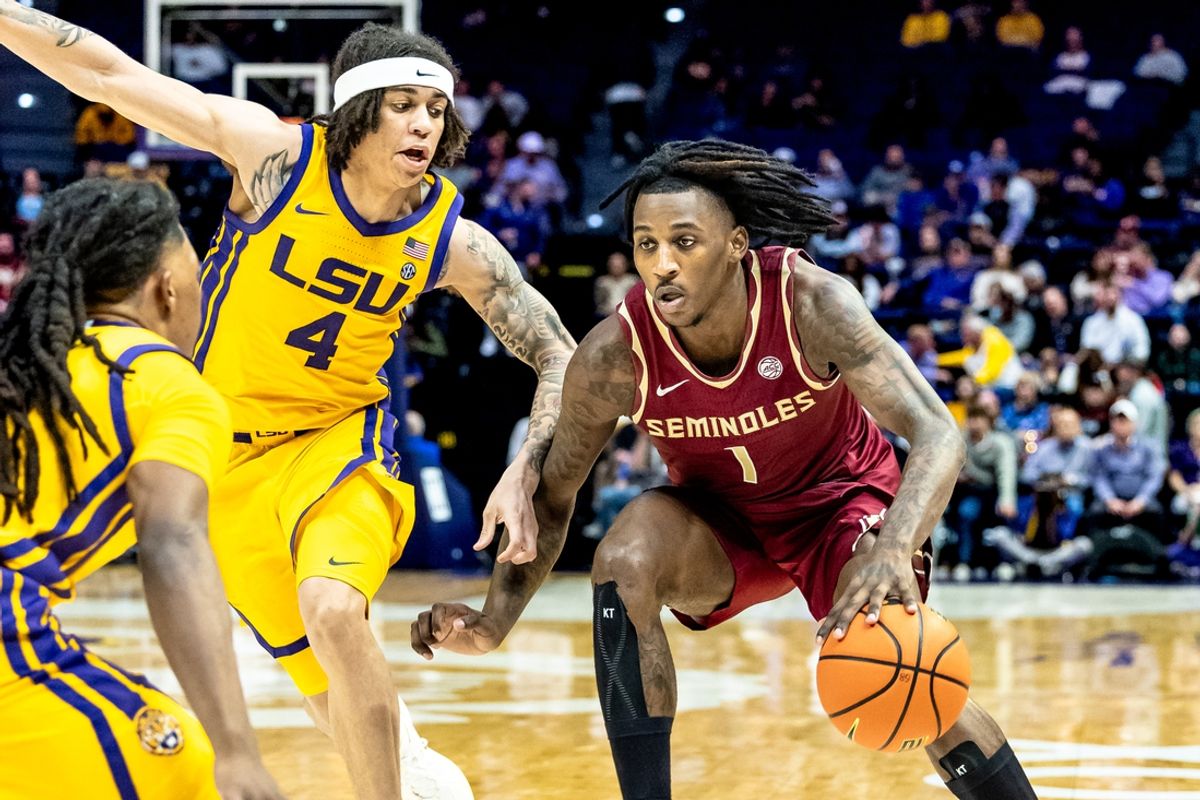 Dec 3, 2024; Baton Rouge, Louisiana, USA; Florida State Seminoles guard Jamir Watkins (1) dribbles against LSU Tigers guard Dji Bailey (4) during the second half at Pete Maravich Assembly Center. Mandatory Credit: Stephen Lew-Imagn Images