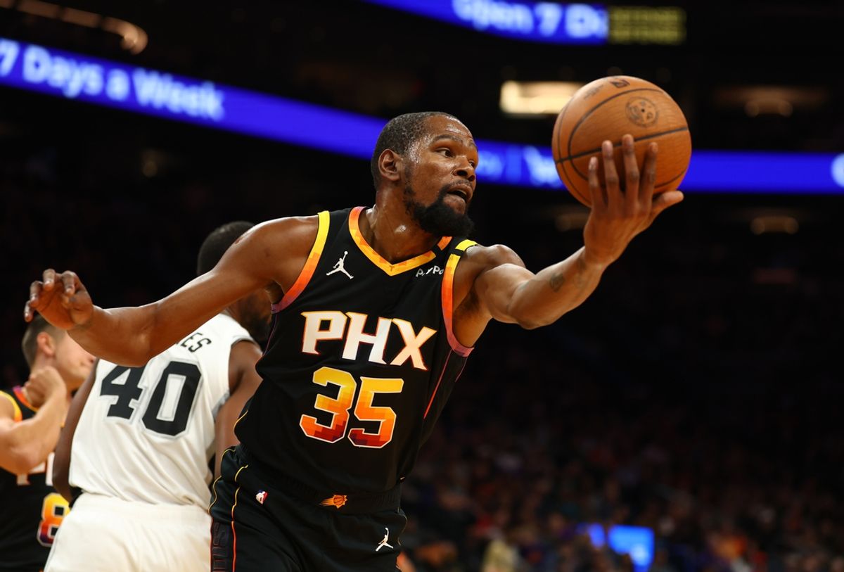 Dec 3, 2024; Phoenix, Arizona, USA; Phoenix Suns forward Kevin Durant (35) against the San Antonio Spurs in the first half of an NBA Cup game at Footprint Center. Mandatory Credit: Mark J. Rebilas-Imagn Images