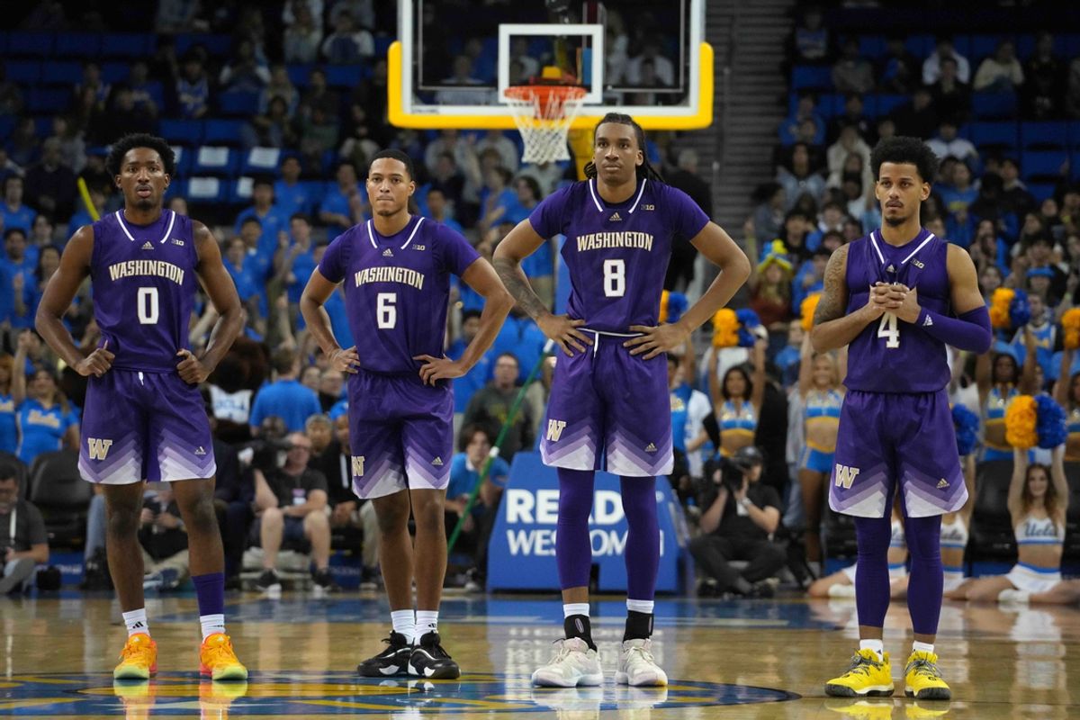 Dec 3, 2024; Los Angeles, California, USA; Washington Huskies guard Mekhi Mason (0), guard Tyree Ihenacho (6), guard Tyler Harris (8) and guard DJ Davis (4) react in the second half against the UCLA Bruins at Pauley Pavilion presented by Wescom. Mandatory Credit: Kirby Lee-Imagn Images