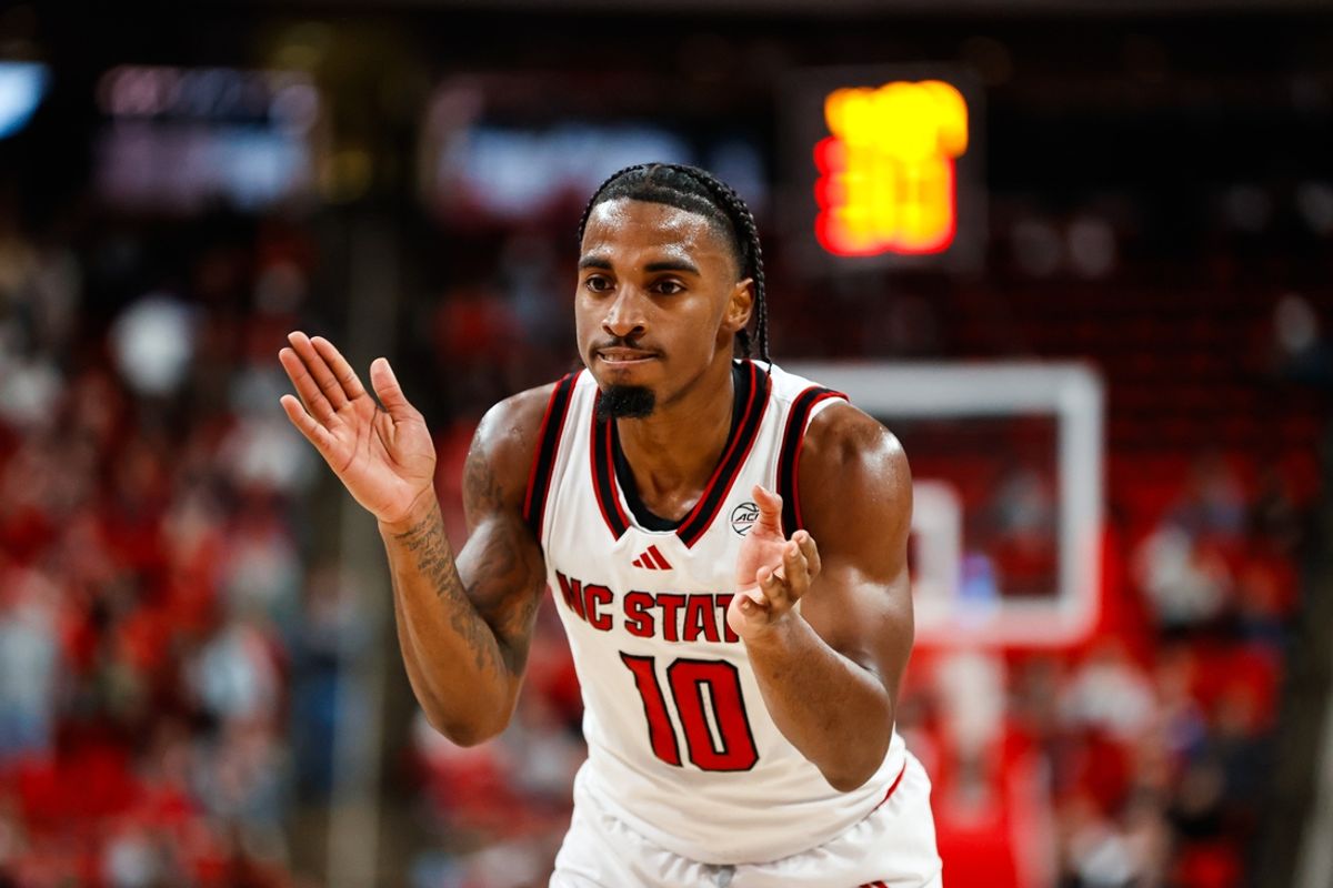 Dec 4, 2024; Raleigh, North Carolina, USA;  North Carolina State Wolfpack guard Marcus Hill (10) reacts during the first half of the game against the Texas Longhorns at Lenovo Center. Mandatory Credit: Jaylynn Nash-Imagn Images