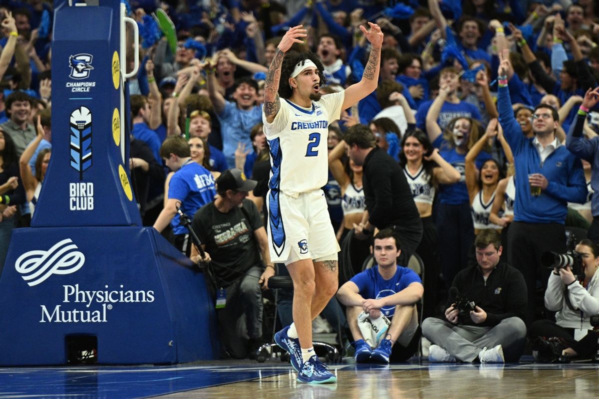 Dec 4, 2024; Omaha, Nebraska, USA; Creighton Bluejays guard Pop Isaacs (2) reacts to the crowd after making a three point basket against the Kansas Jayhawks during the second half at CHI Health Center Omaha. Mandatory Credit: Steven Branscombe-Imagn Images