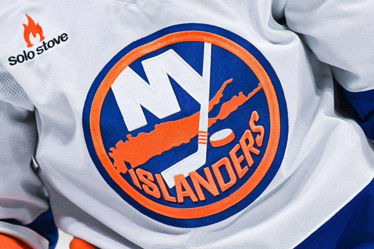 Dec 3, 2024; Montreal, Quebec, CAN; View of a New York Islanders logo on a jersey worn by a member of the team during warm-up before the game against the Montreal Canadiens at Bell Centre. Mandatory Credit: David Kirouac-Imagn Images