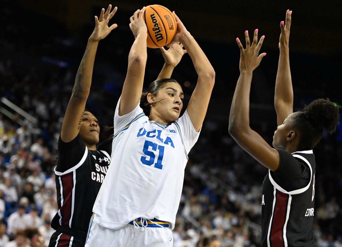Nov 24, 2024; Los Angeles, California, USA; UCLA Bruins center Lauren Betts (51) is defended by South Carolina Gamecocks forward Ashlyn Watkins (2) and South Carolina Gamecocks forward Joyce Edwards (8) during the third quarter at Pauley Pavilion presented by Wescom. Mandatory Credit: Robert Hanashiro-Imagn Images
