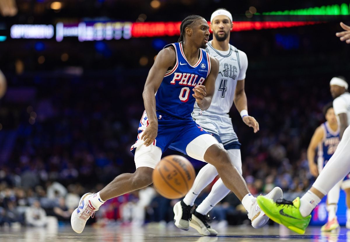 Dec 4, 2024; Philadelphia, Pennsylvania, USA; Philadelphia 76ers guard Tyrese Maxey (0) and Orlando Magic guard Jalen Suggs (4) during the third quarter at Wells Fargo Center. Mandatory Credit: Bill Streicher-Imagn Images