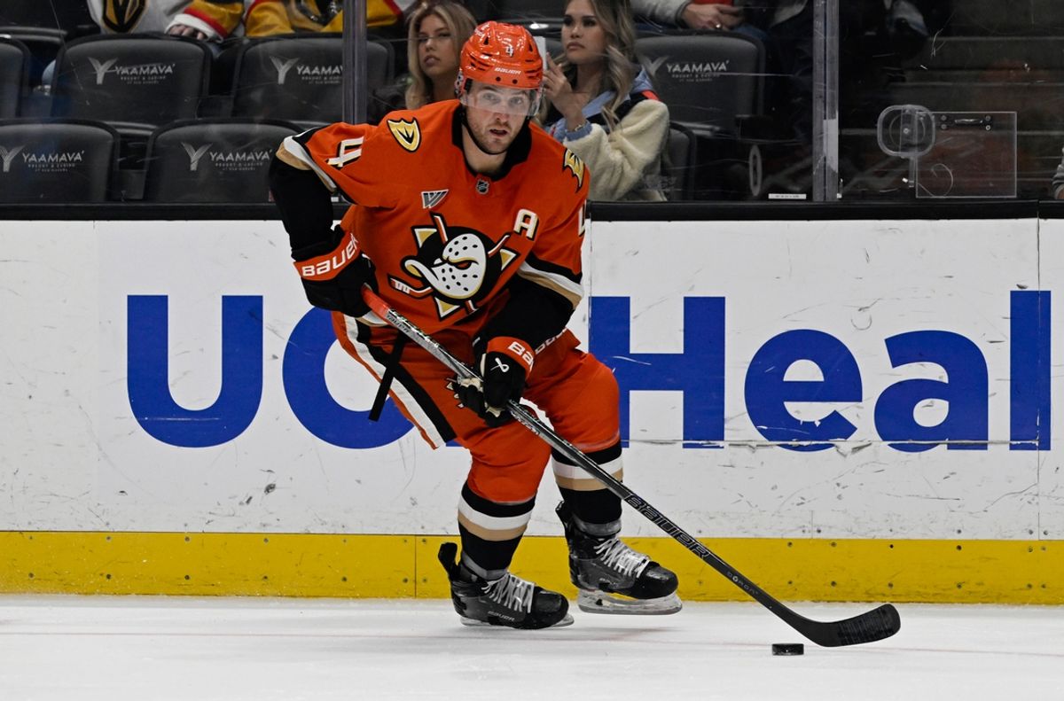 Dec 4, 2024; Anaheim, California, USA;  Anaheim Ducks defenseman Cam Fowler (4) handles the puck against the Vegas Golden Knights during the third period at Honda Center. Mandatory Credit: Alex Gallardo-Imagn Images