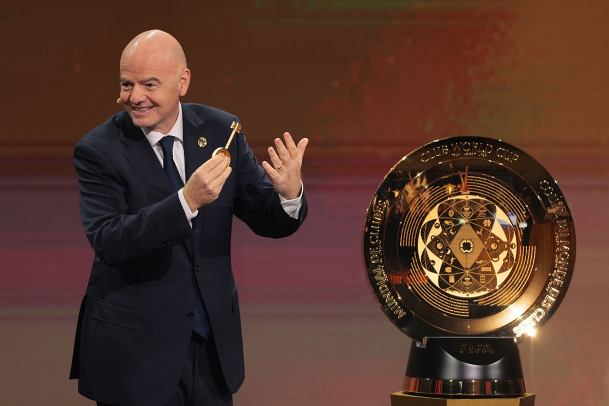 Dec 5, 2024; Miami, FL, USA; FIFA president Gianni Infantino presents the FIFA Club World Cup trophy during the Club Word Cup draw at Telemundo Studios. Mandatory Credit: Sam Navarro-Imagn Images