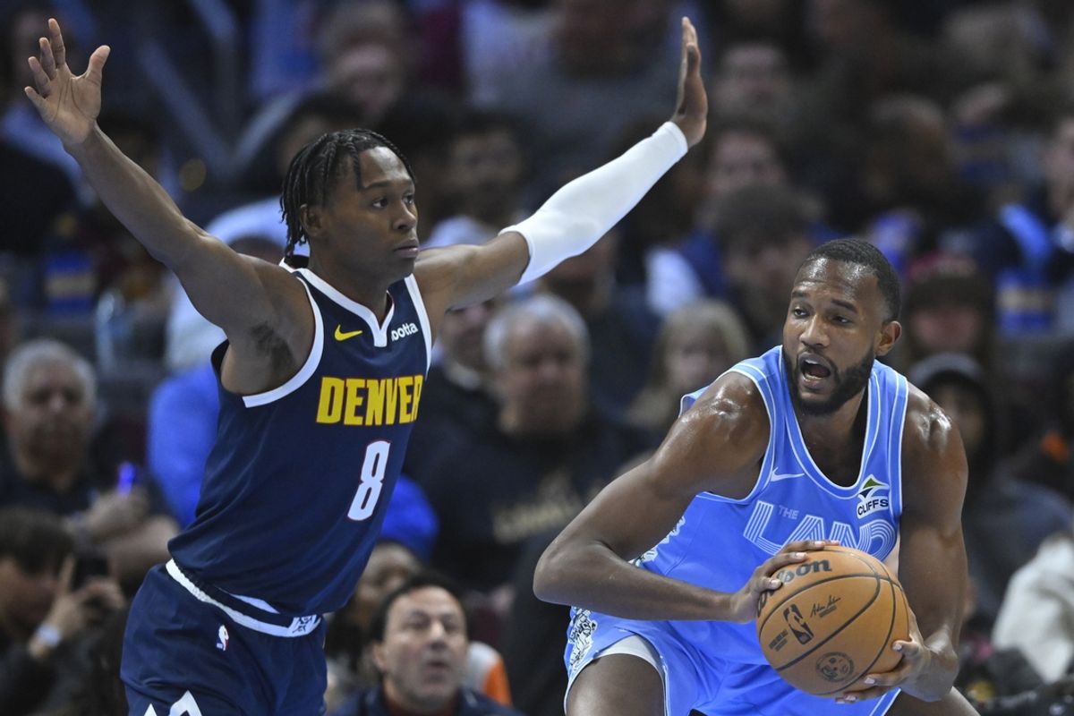 Dec 5, 2024; Cleveland, Ohio, USA; Denver Nuggets forward Peyton Watson (8) defends Cleveland Cavaliers forward Evan Mobley (4) in the second quarter at Rocket Mortgage FieldHouse. Mandatory Credit: David Richard-Imagn Images