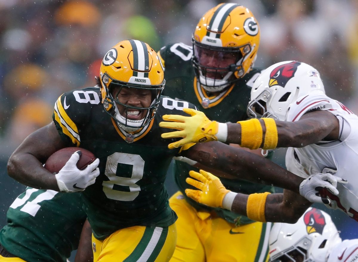 Green Bay Packers running back Josh Jacobs (8) rushes against the Arizona Cardinals on Sunday, Oct. 13, 2024, at Lambeau Field in Green Bay.