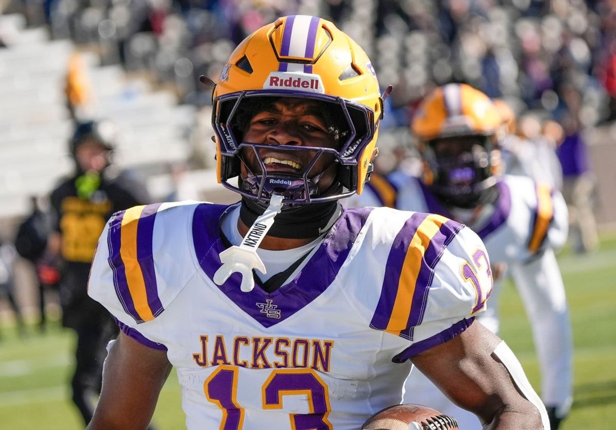 Dec 6, 2024; Birmingham, AL, USA; Jackson's Ezavier Crowell (13) breaks a long touchdown run on the Aggie’s first possession against Cherokee County at Protective Stadium in the AHSAA 4A State Championship game.